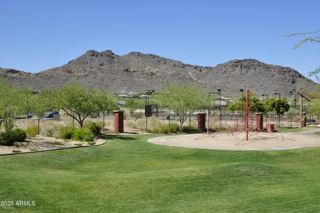 a view of a patio with a table and chairs