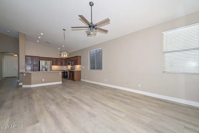 a view of a kitchen and a kitchen with a window