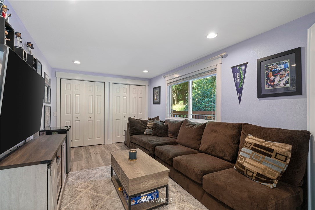 23019 19th Drive Southeast Bothell, WA 98021 - Photo 14 of 28 a living room with furniture and a flat screen tv
