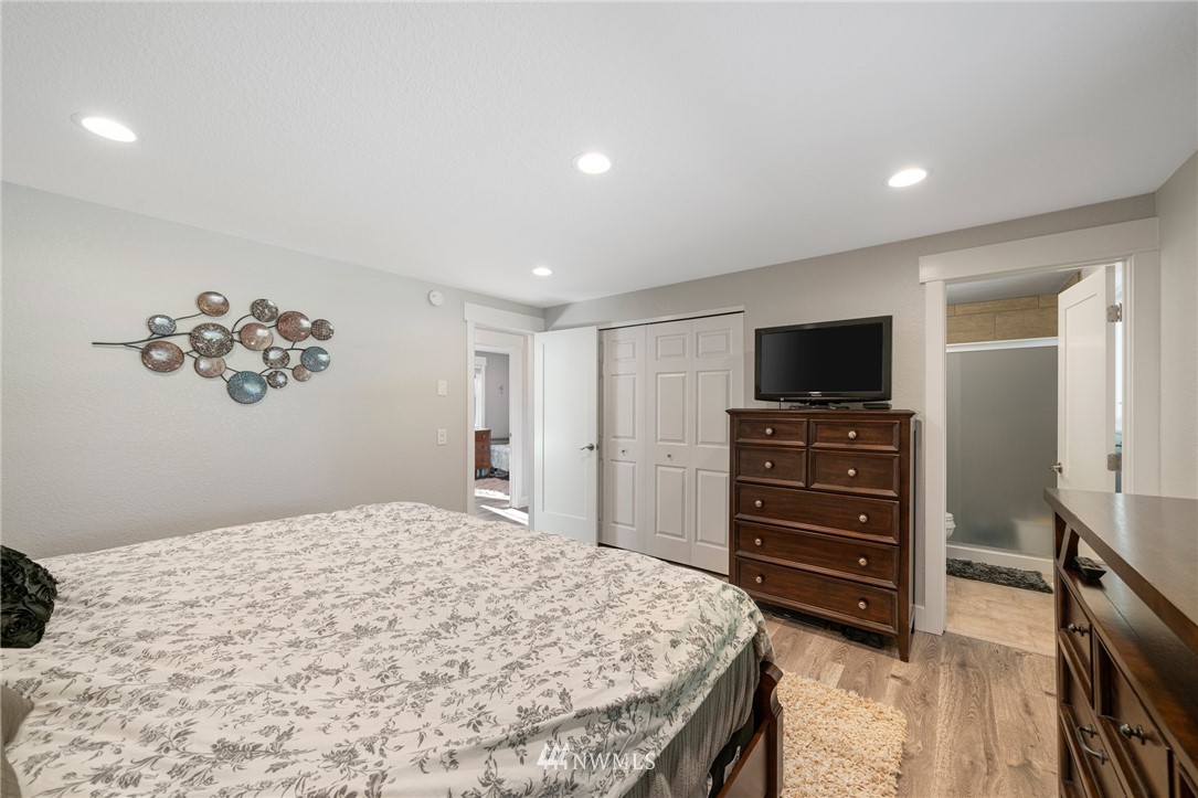 23019 19th Drive Southeast Bothell, WA 98021 - Photo 18 of 28 a bedroom with a bed and a television
