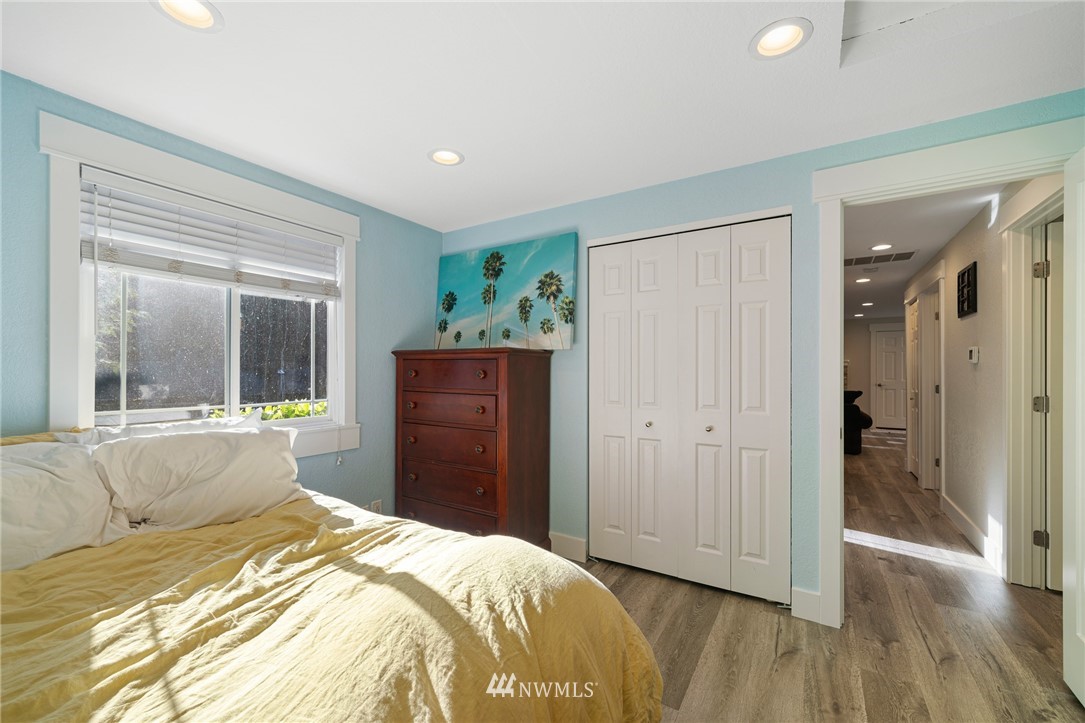 23019 19th Drive Southeast Bothell, WA 98021 - Photo 20 of 28 a bedroom with a bed and a large window