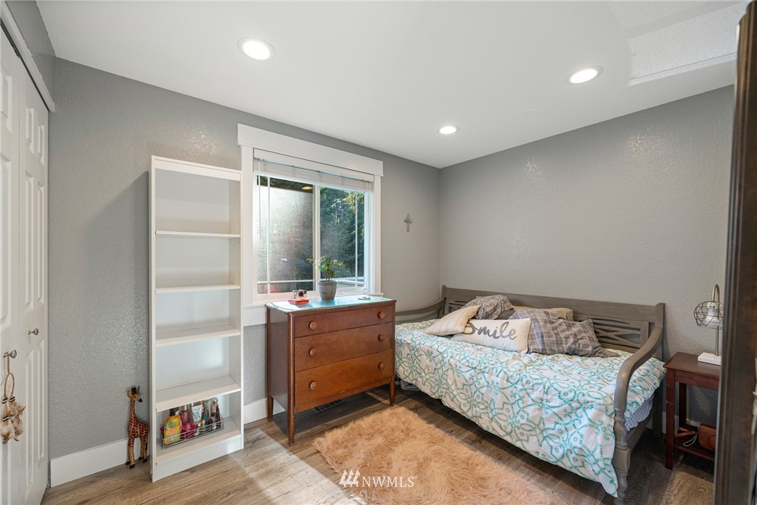 23019 19th Drive Southeast Bothell, WA 98021 - Photo 21 of 28 a bedroom with a bed and window