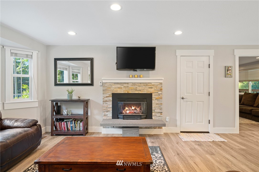 23019 19th Drive Southeast Bothell, WA 98021 - Photo 4 of 28 a living room with furniture fireplace and flat screen tv
