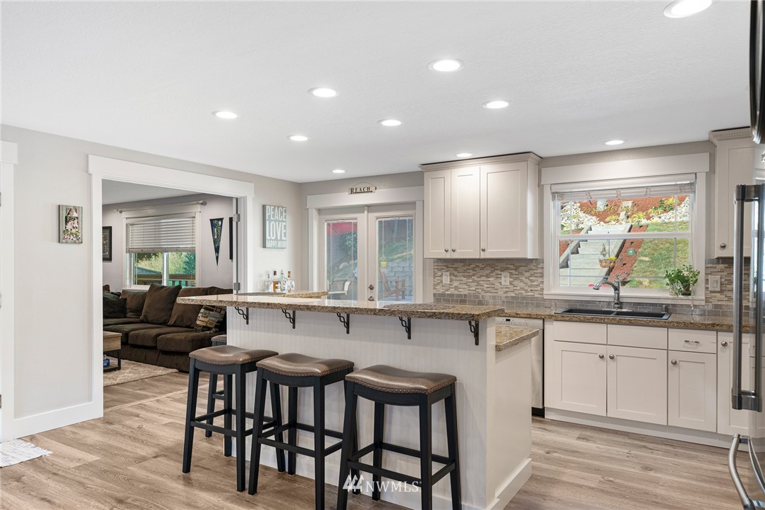 23019 19th Drive Southeast Bothell, WA 98021 - Photo 8 of 28 a kitchen with lots of counter space and dining table