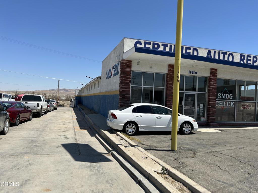 1401 Main Street Barstow, CA 92311 - Photo 11 of 66 a car parked in front of a building