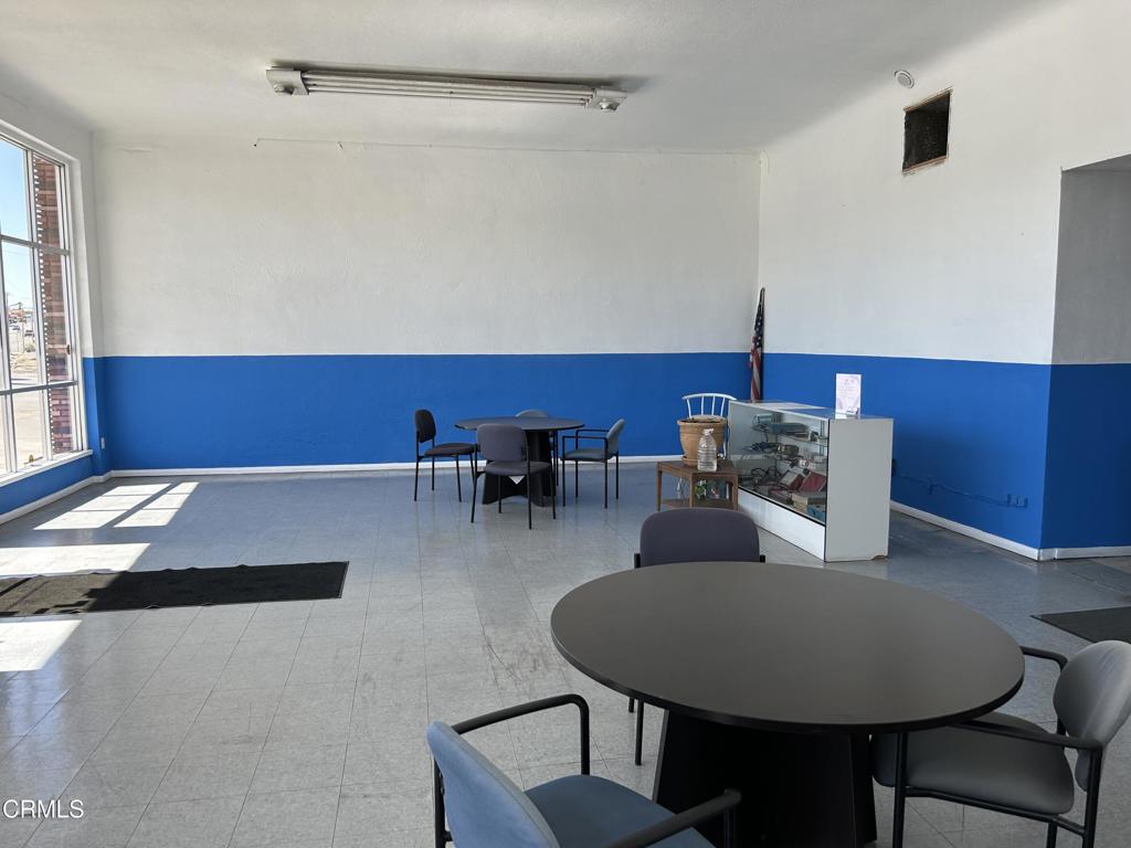 1401 Main Street Barstow, CA 92311 - Photo 63 of 66 a living room with furniture and a table