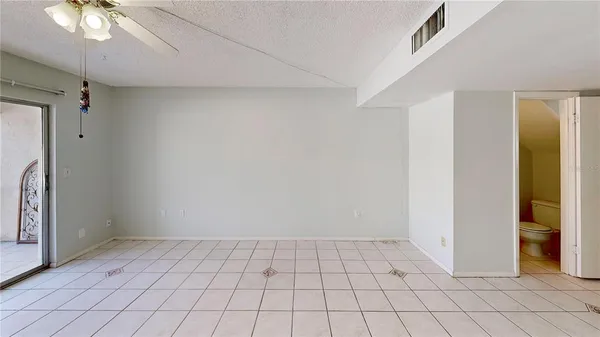 a view of staircase with white walls and windows