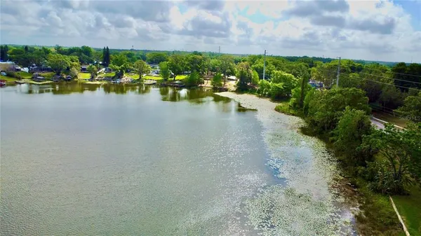 a view of a lake with a yard