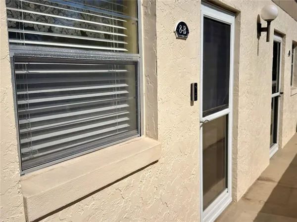 a kitchen with a refrigerator and a stove top oven