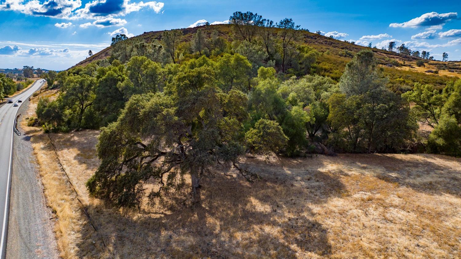 0 Highway 12 Valley Springs, CA 95252 - Photo 33 of 48 a view of a large building with a tree in the background