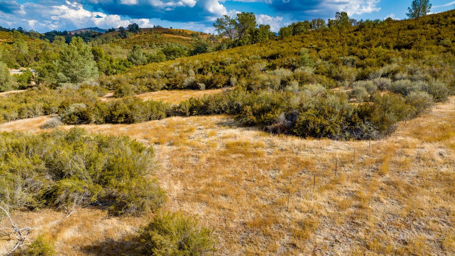 0 Highway 12 Valley Springs, CA 95252 - Photo 38 of 48 a view of a large building with mountains in the background