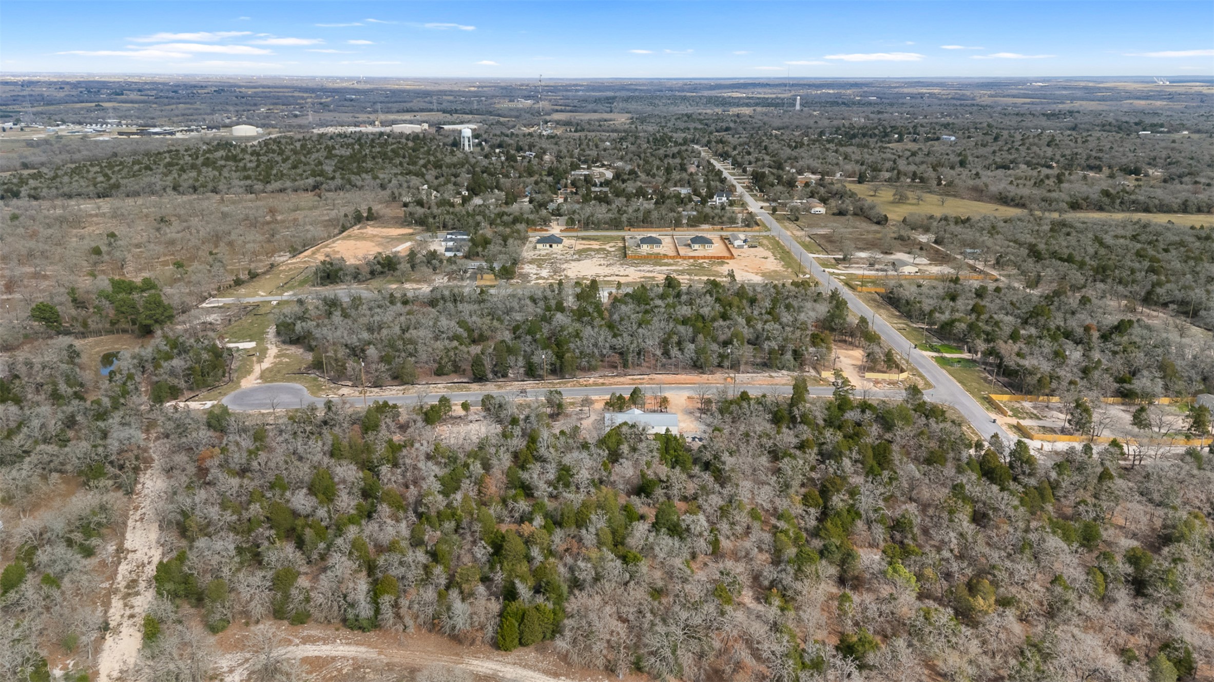 an aerial view of residential building and green space