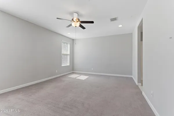 a view of an empty room with a window