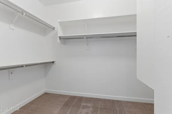 a view of an empty walk in closet
