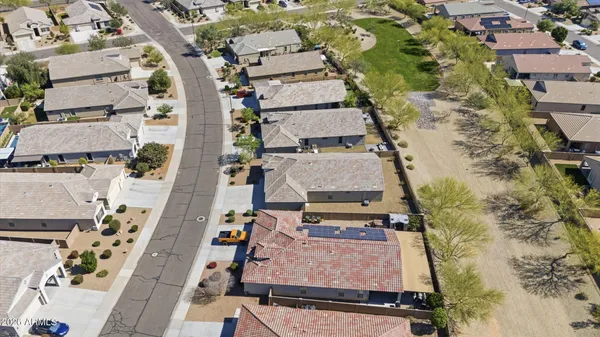 an aerial view of residential houses with outdoor space