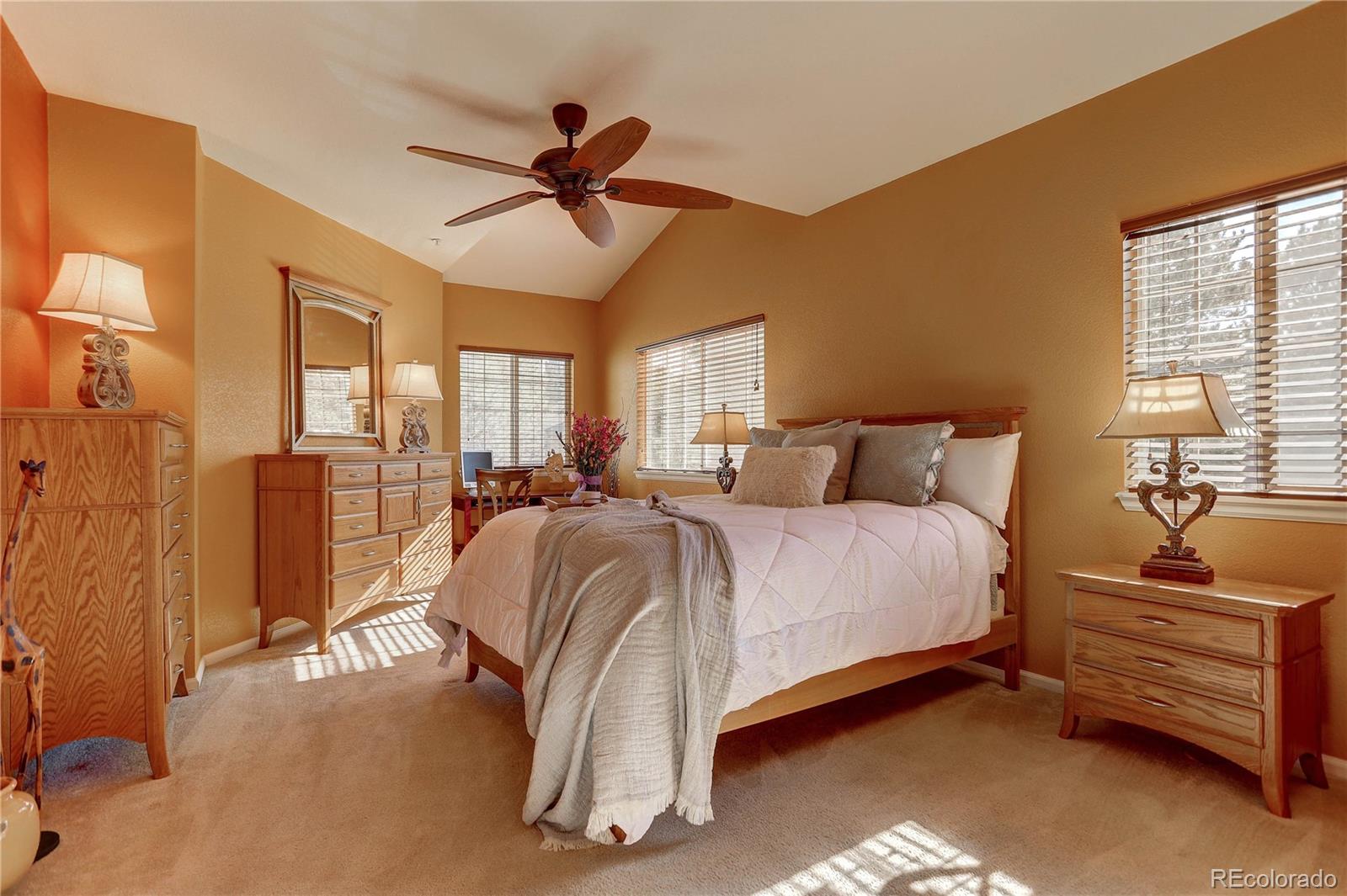 6830 Xavier Circle, Unit 3 Arvada, CO 80030 - Photo 13 of 28 a bedroom with a bed and ceiling fan