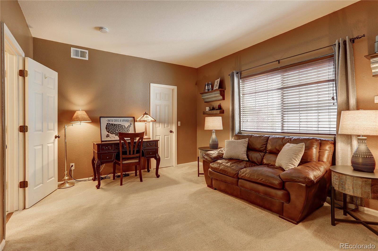 6830 Xavier Circle, Unit 3 Arvada, CO 80030 - Photo 19 of 28 a living room with furniture and a window