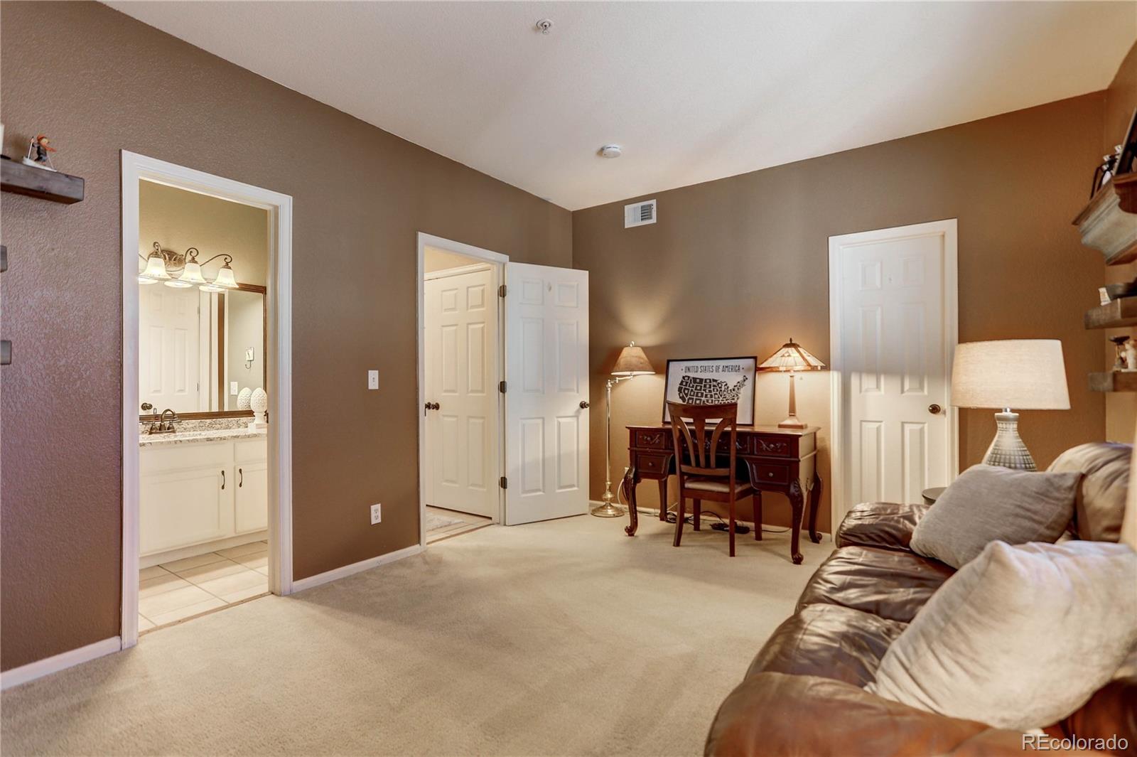 6830 Xavier Circle, Unit 3 Arvada, CO 80030 - Photo 21 of 28 a living room with furniture and a window