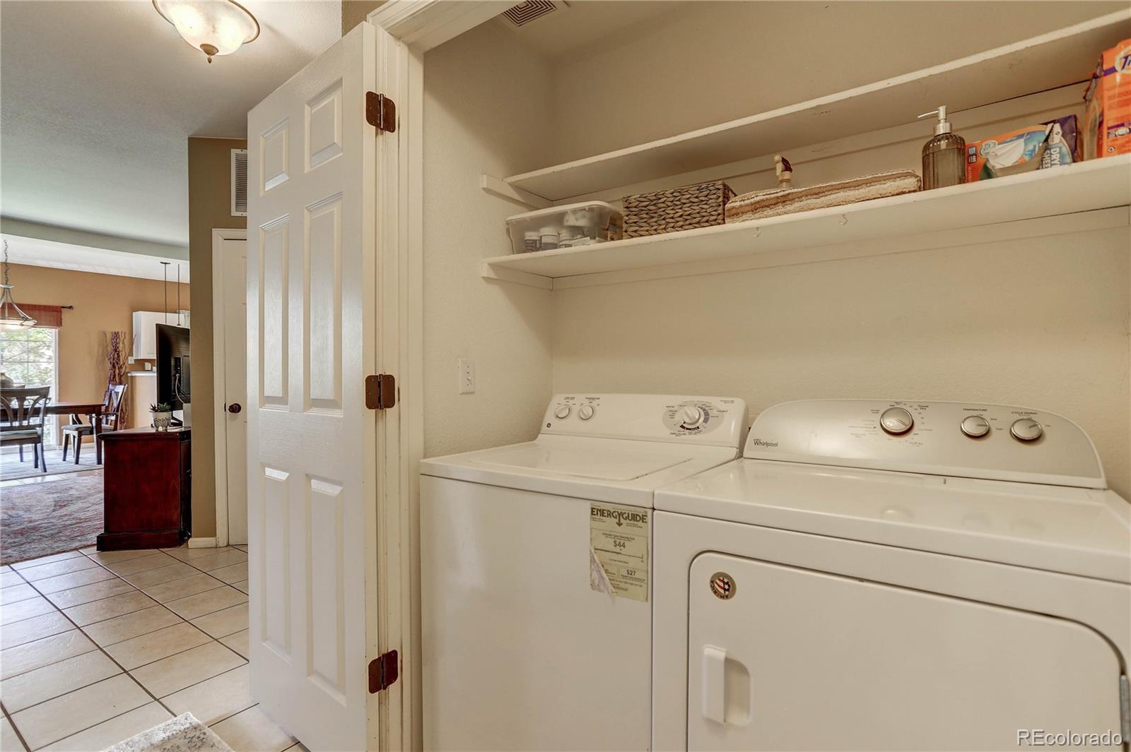 6830 Xavier Circle, Unit 3 Arvada, CO 80030 - Photo 22 of 28 a utility room with dryer and washer
