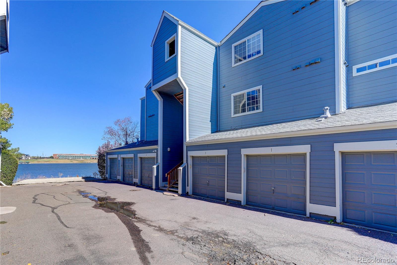 6830 Xavier Circle, Unit 3 Arvada, CO 80030 - Photo 27 of 28 a view of a house with a outdoor space