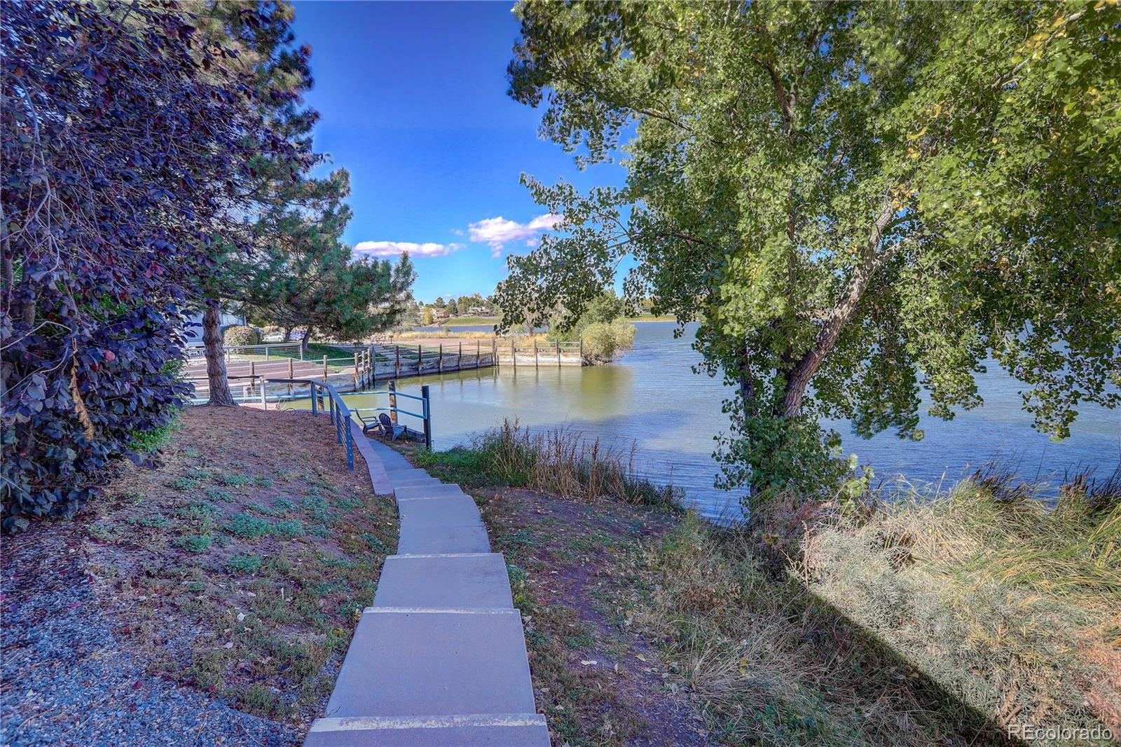 6830 Xavier Circle, Unit 3 Arvada, CO 80030 - Photo 3 of 28 a view of a pathway with a yard