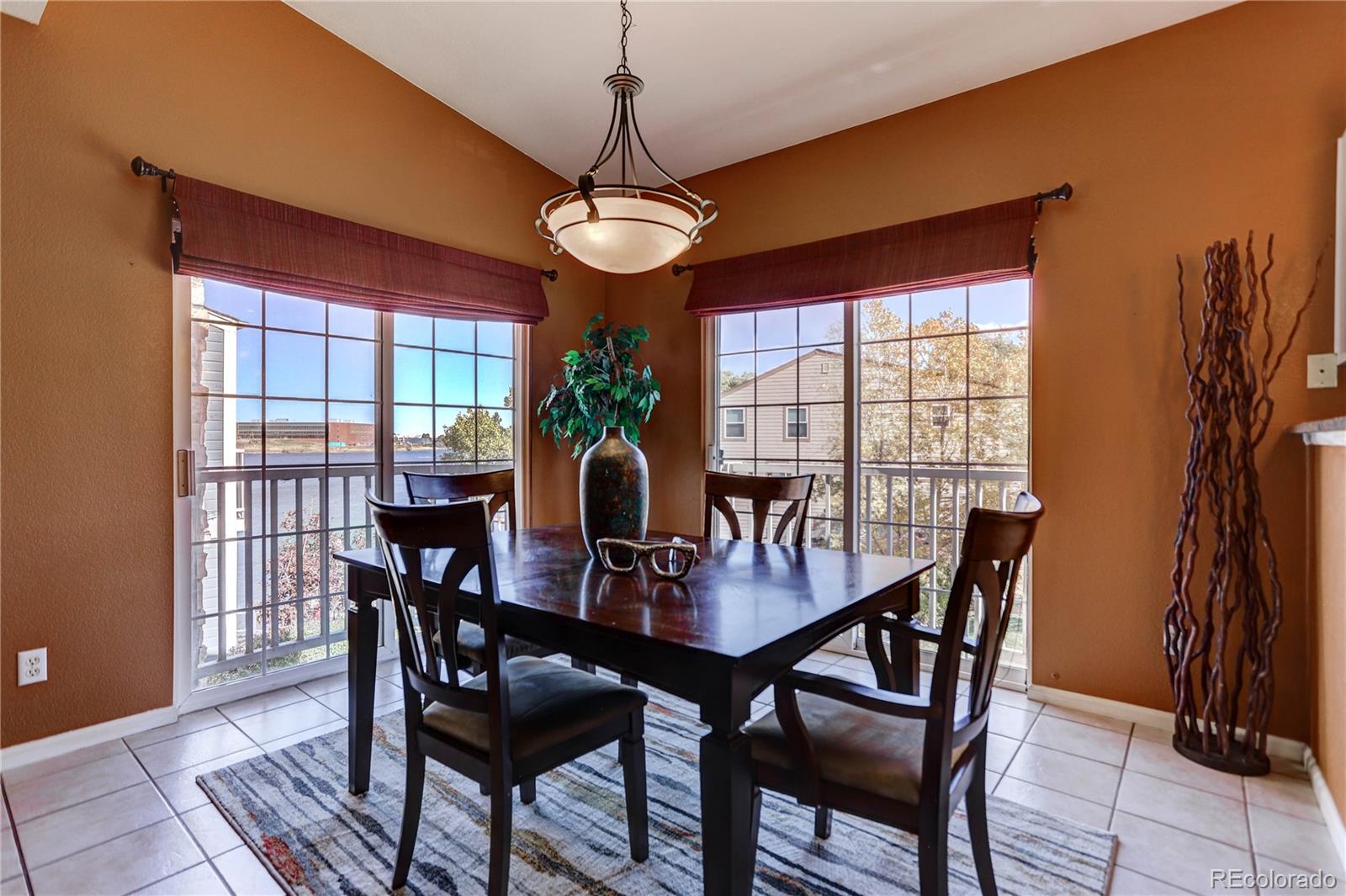 6830 Xavier Circle, Unit 3 Arvada, CO 80030 - Photo 5 of 28 a view of a dining room with furniture window and outside view