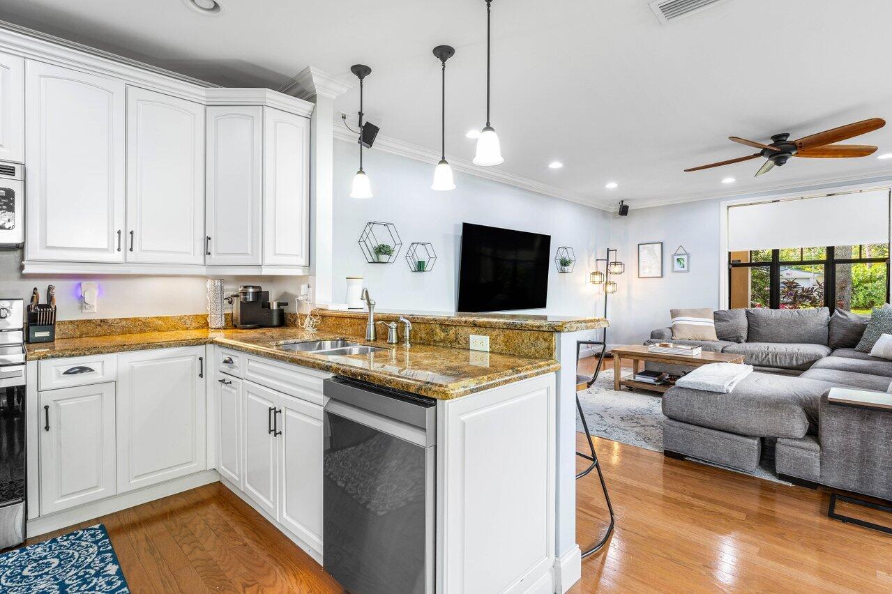 507 Southwest 17th Street Fort Lauderdale, FL 33315 - Photo 7 of 25 a kitchen with a sink stove and cabinets