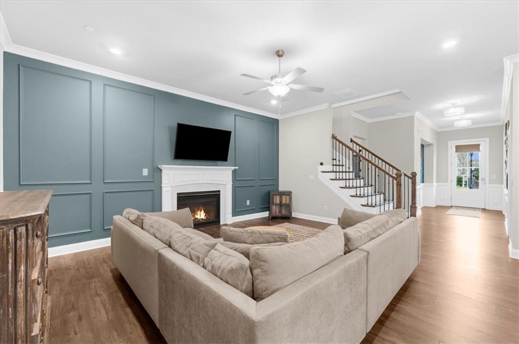 320 Senna Street Marietta, GA 30064 - Photo 12 of 53 a living room with furniture a fireplace and a flat screen tv
