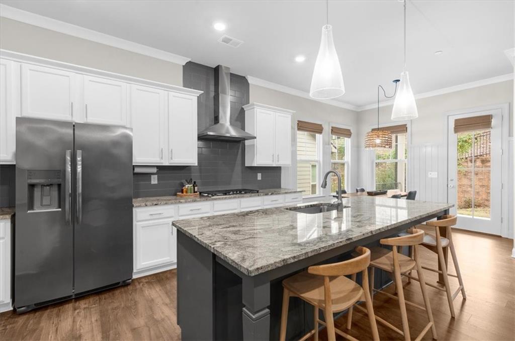 320 Senna Street Marietta, GA 30064 - Photo 15 of 53 a kitchen with granite countertop kitchen island stainless steel appliances a sink stove and refrigerator