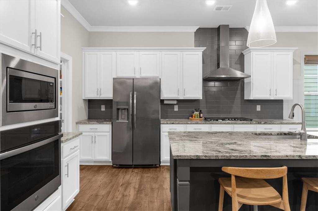 320 Senna Street Marietta, GA 30064 - Photo 17 of 53 a kitchen with a refrigerator a stove a sink and wooden floor
