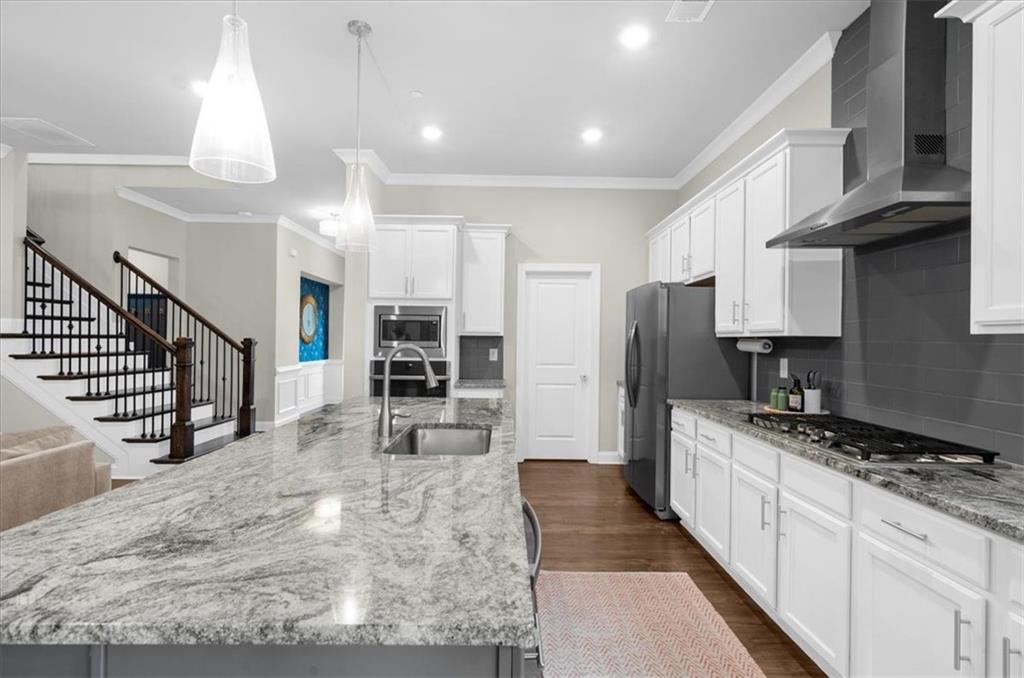 320 Senna Street Marietta, GA 30064 - Photo 18 of 53 a kitchen with stainless steel appliances granite countertop a sink a stove and a refrigerator