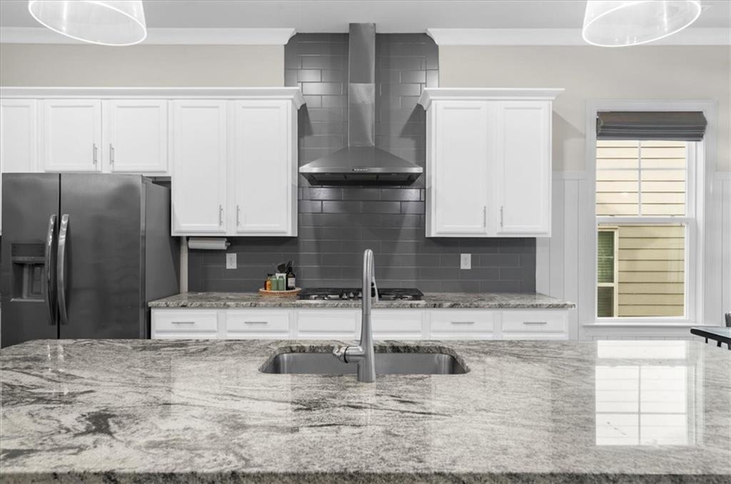 320 Senna Street Marietta, GA 30064 - Photo 19 of 53 a kitchen with stainless steel appliances granite countertop a sink and a refrigerator