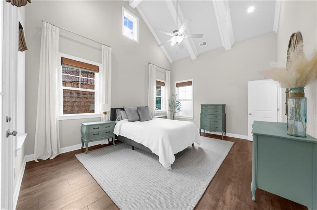 320 Senna Street Marietta, GA 30064 - Photo 26 of 53 a spacious bedroom with a bed wooden floor and windows