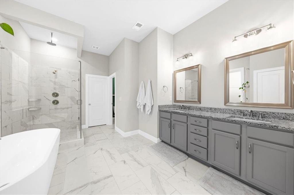 320 Senna Street Marietta, GA 30064 - Photo 30 of 53 a spacious bathroom with a granite countertop sink mirror and shower