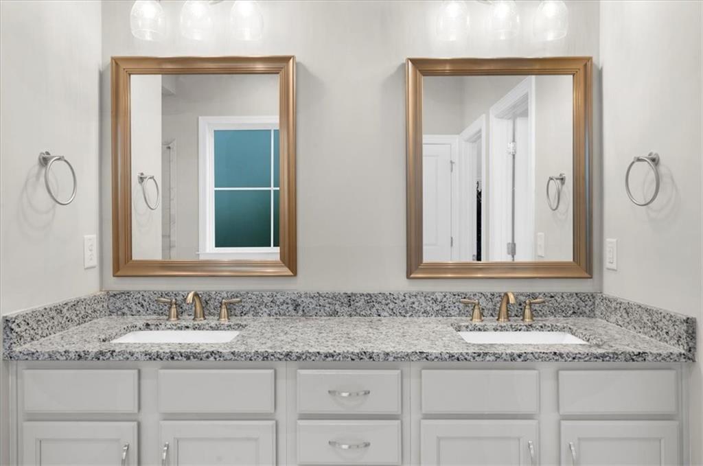 320 Senna Street Marietta, GA 30064 - Photo 32 of 53 a bathroom with double sink and a mirror