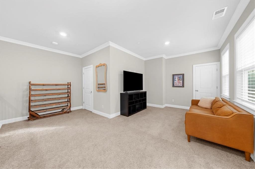 320 Senna Street Marietta, GA 30064 - Photo 34 of 53 a living room with furniture and a flat screen tv