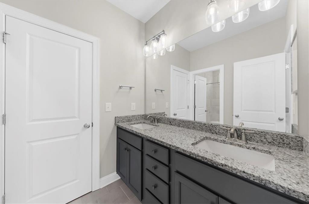 320 Senna Street Marietta, GA 30064 - Photo 40 of 53 a bathroom with a granite countertop double vanity sink and a mirror