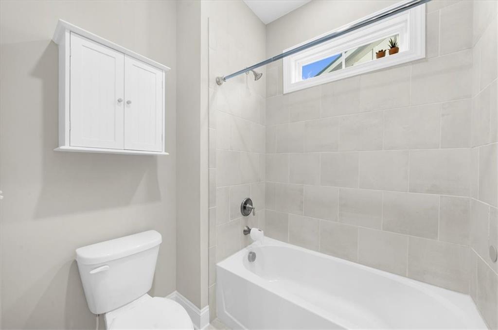 320 Senna Street Marietta, GA 30064 - Photo 42 of 53 a white bath tub sitting next to a white toilet