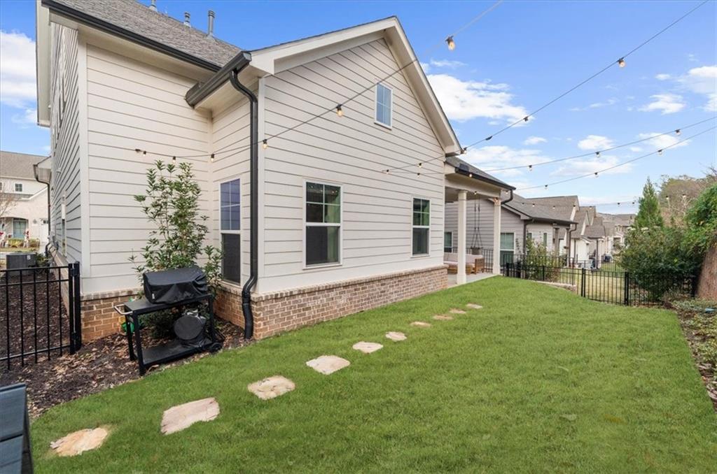 320 Senna Street Marietta, GA 30064 - Photo 44 of 53 a backyard of a house with table and chairs