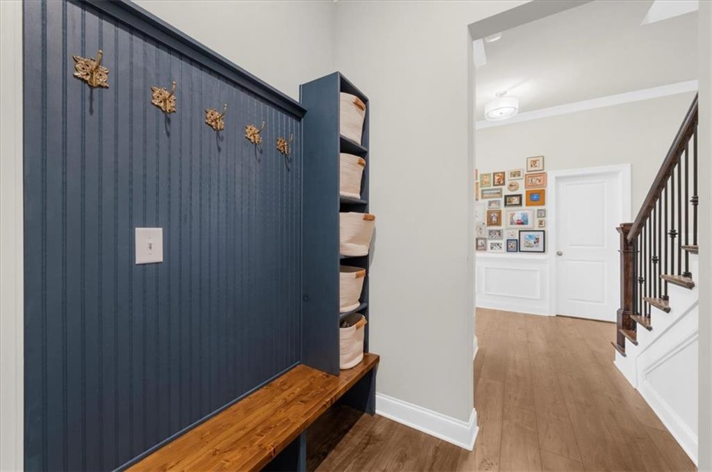 320 Senna Street Marietta, GA 30064 - Photo 7 of 53 a view of a hallway with wooden floor and stairs