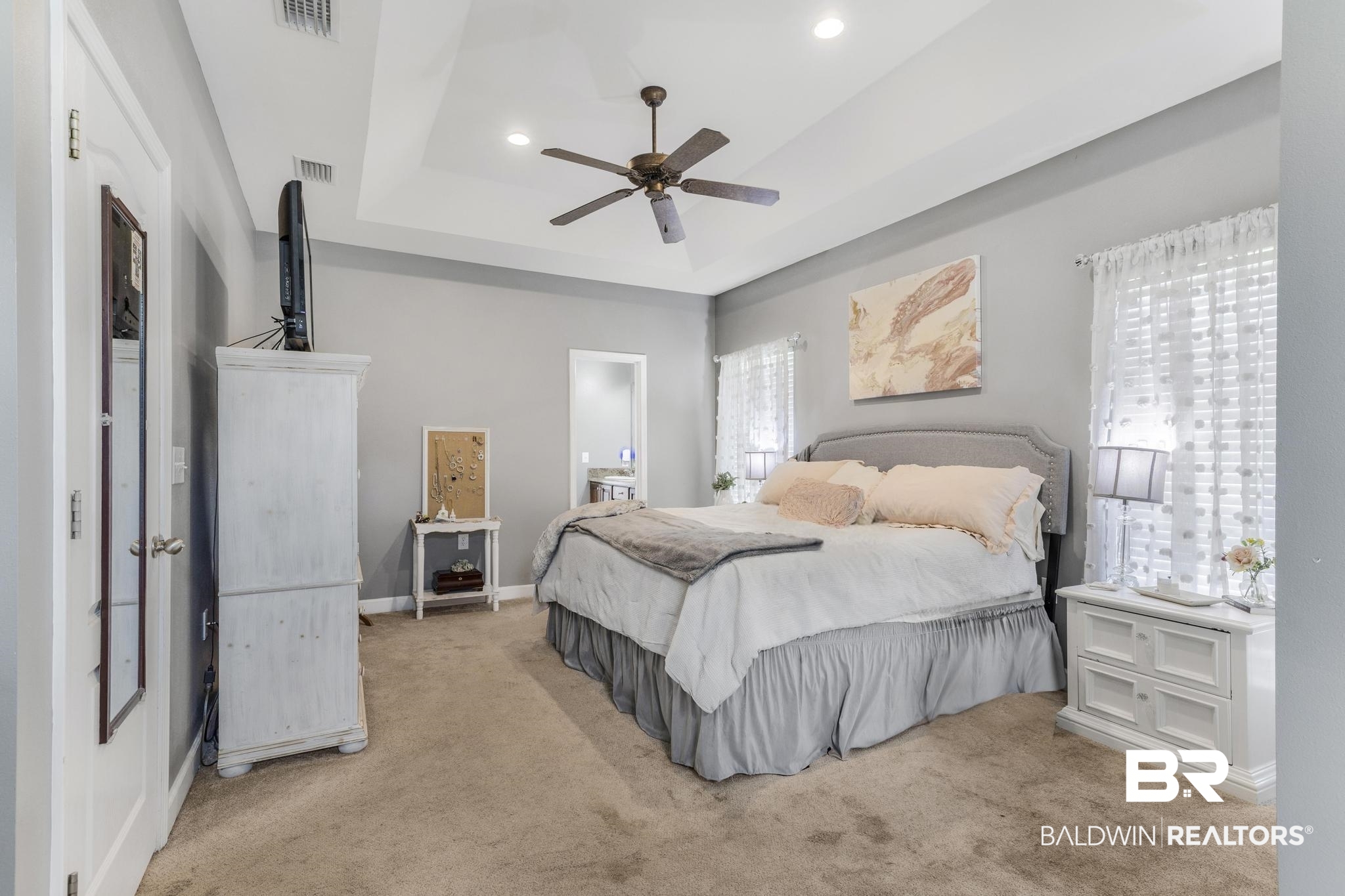 35814 Delvan Lane Bay Minette, AL 36507 - Photo 38 of 53 Spacious bedroom featuring a tray ceiling, recessed lighting, ceiling fan, and carpet flooring