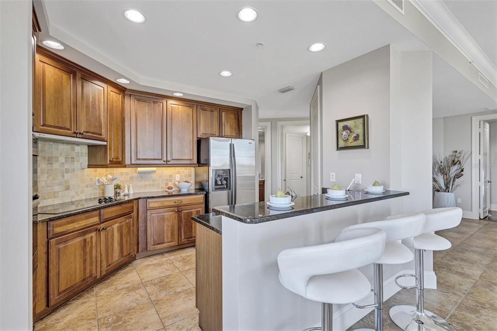 140 Riviera Dunes Way, Unit 206 Palmetto, FL 34221 - Photo 10 of 46 a kitchen with stainless steel appliances granite countertop a sink and cabinets