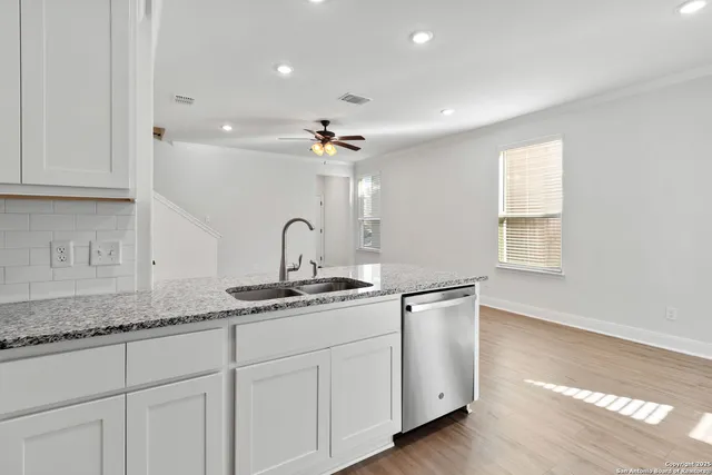 a kitchen with sink and window