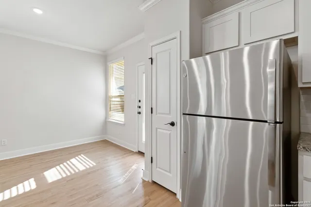 a view of kitchen with wooden floor