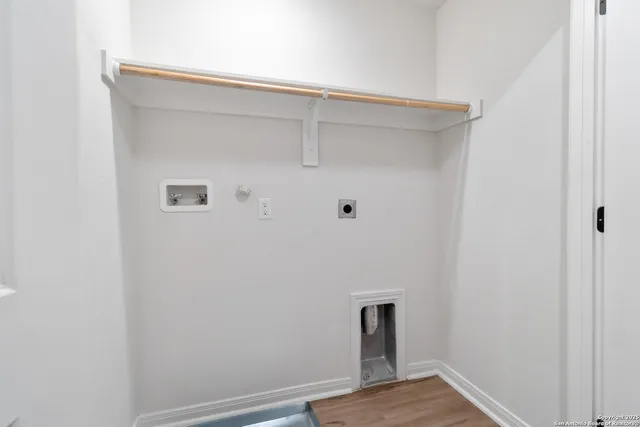 an empty room with white cabinet