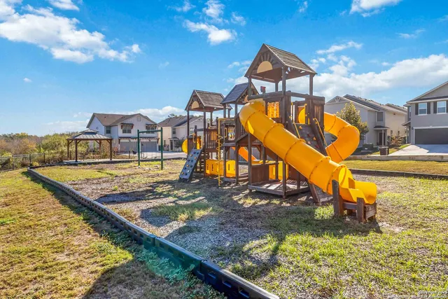 a view of a swimming pool with a patio