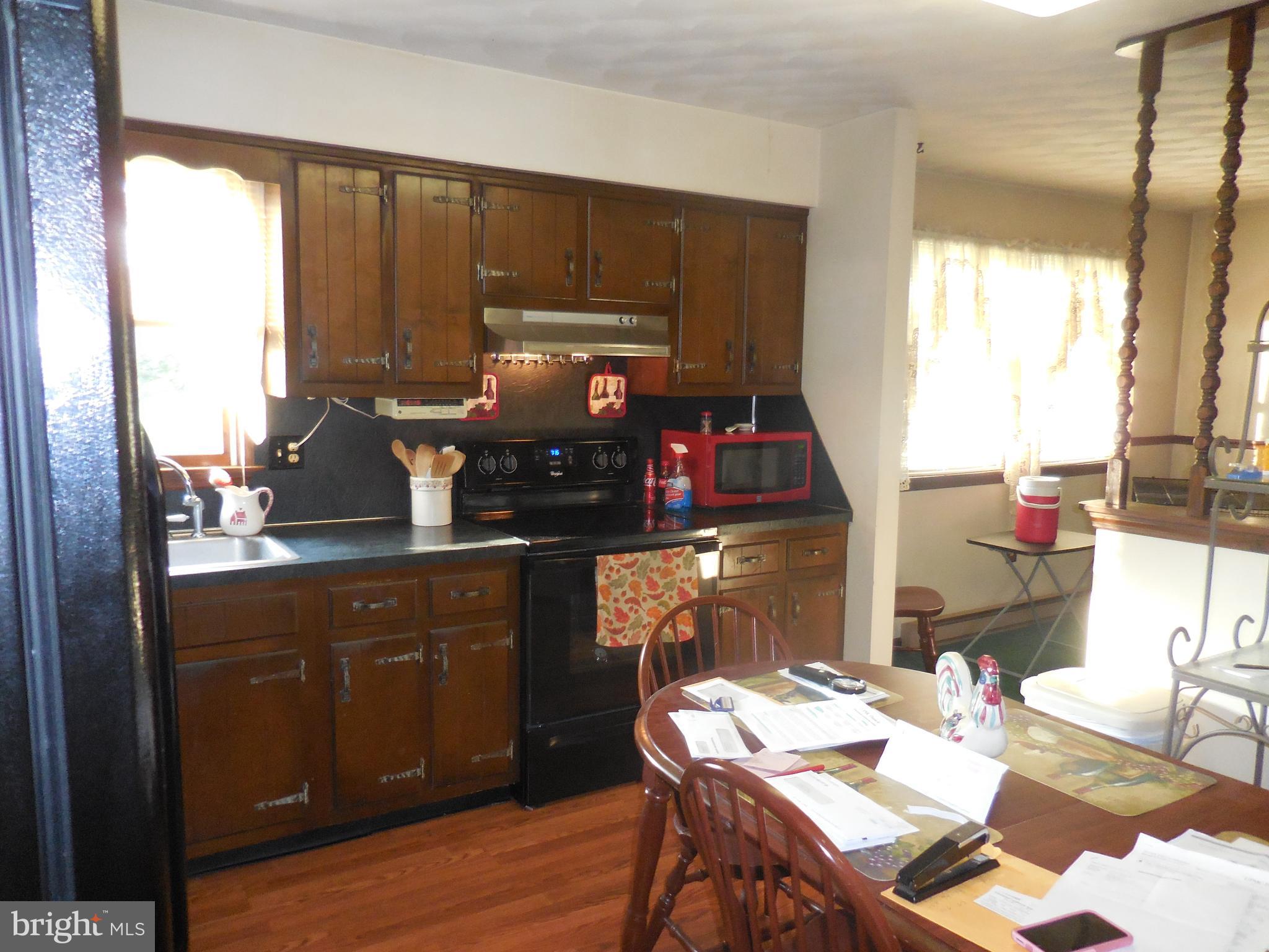 155 Farm Valley Road Wellsville, PA 17365 - Photo 13 of 31 a kitchen with a sink appliances and cabinets