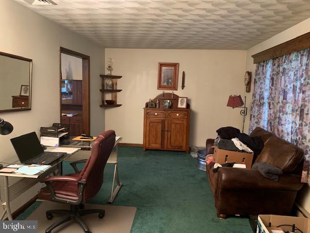 155 Farm Valley Road Wellsville, PA 17365 - Photo 17 of 31 a livingroom with workspace and a couch