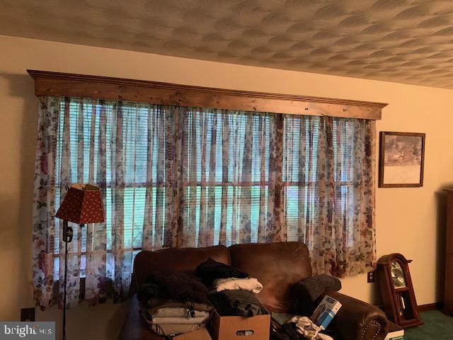 155 Farm Valley Road Wellsville, PA 17365 - Photo 18 of 31 a bed sitting in a room next to a window