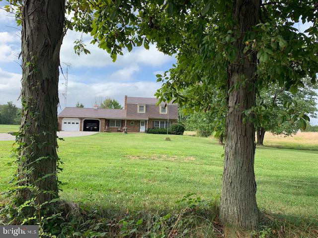 155 Farm Valley Road Wellsville, PA 17365 - Photo 3 of 31 a view of a garden with a large tree